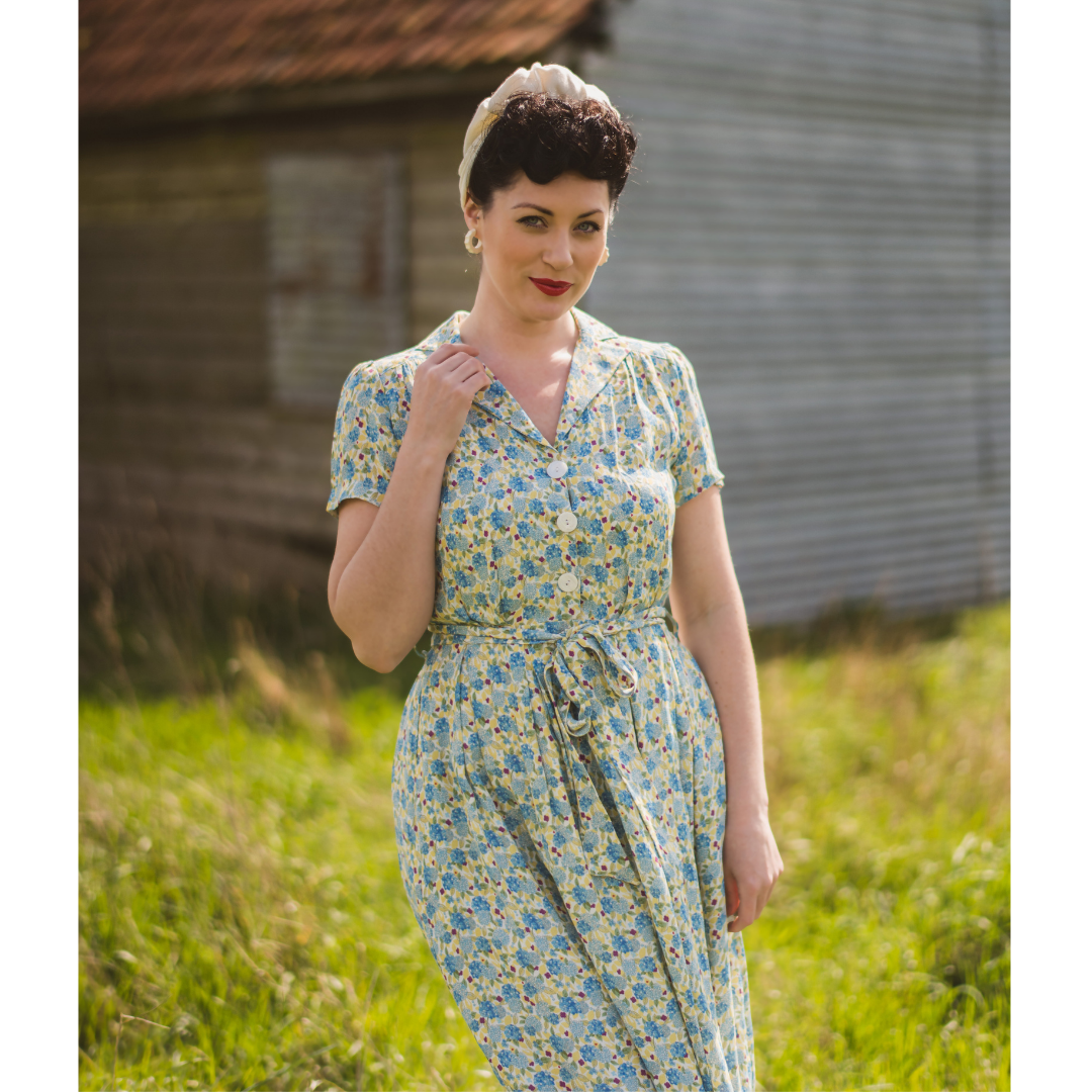 Woman wearing 1940s Katherine Yellow Floral Shirt Dress from Weekend Doll