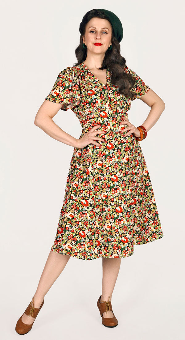 https://www.weekenddoll.co.uk/cdn/shop/files/Betty-Dress-in-Berry-Print-Model-1_600x.jpg?v=1706104228