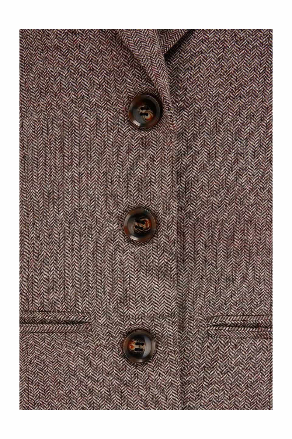 Close-up of a brown wool blend herringbone with buttons 
