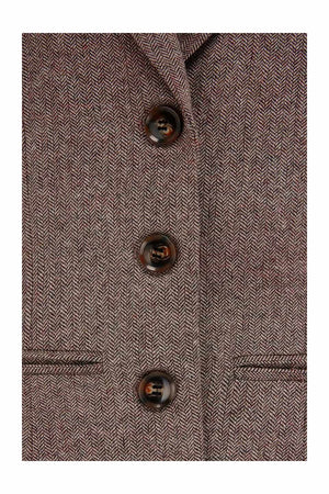 Close-up of a brown wool blend herringbone with buttons 